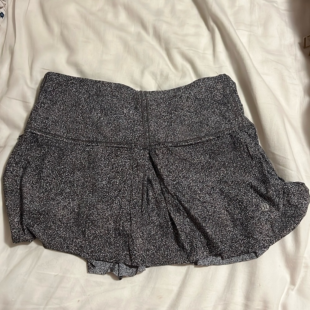Lululemon tennis skirt. Shorts underneath with pockets.